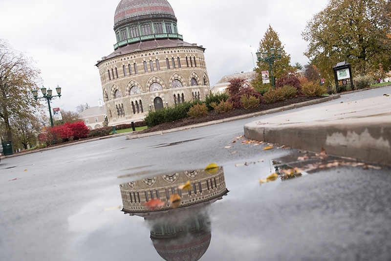 The Nott Memorial reflected in a puddle the result of a recent rain storm.