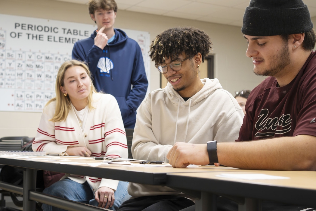 Students in a civil engineering class engaged in thoughtful conversation