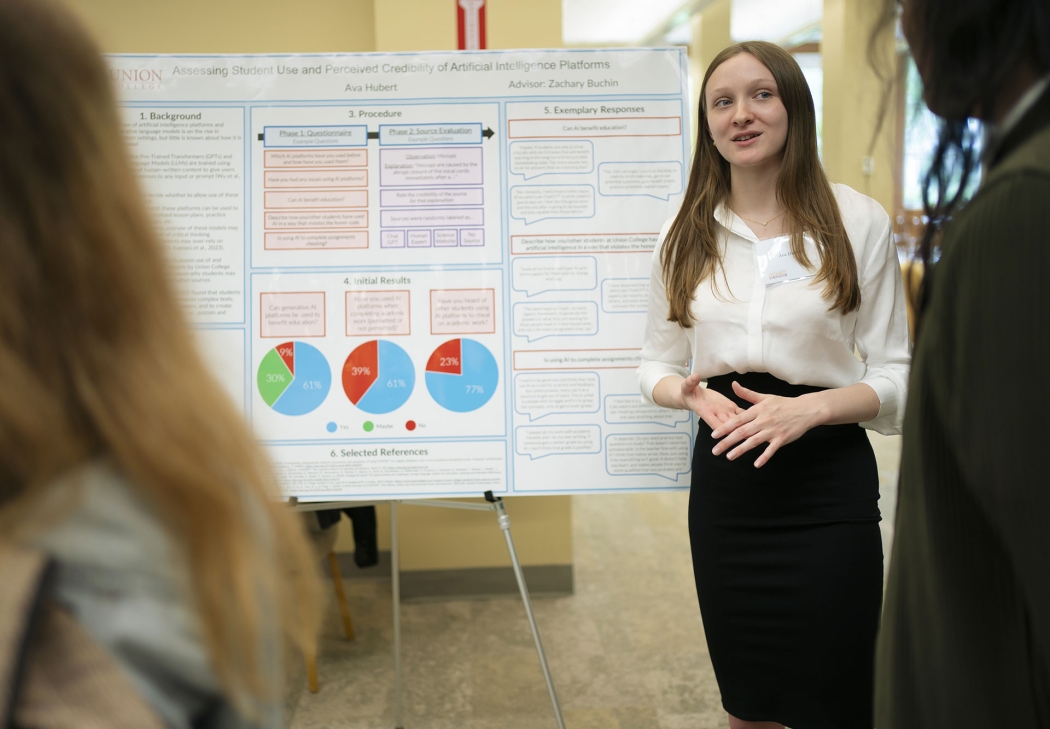 A student presents her research at the Steinmetz Symposium poster session.