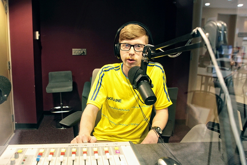 A student in the WRUC broadcasting studio