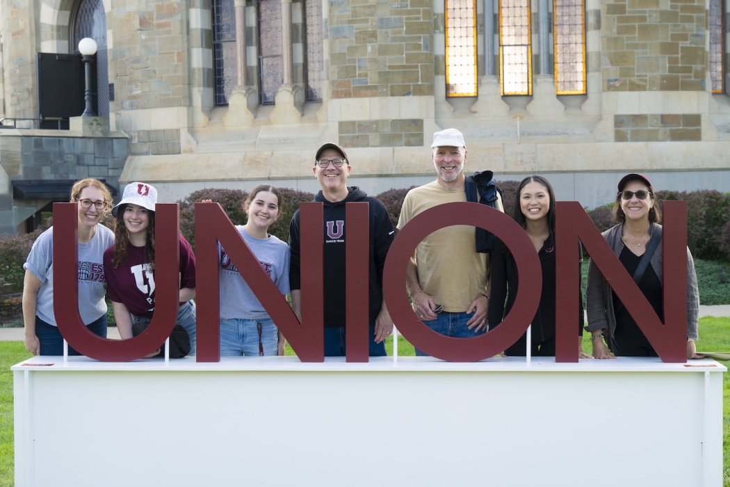 Union family and friends posing with Union sign