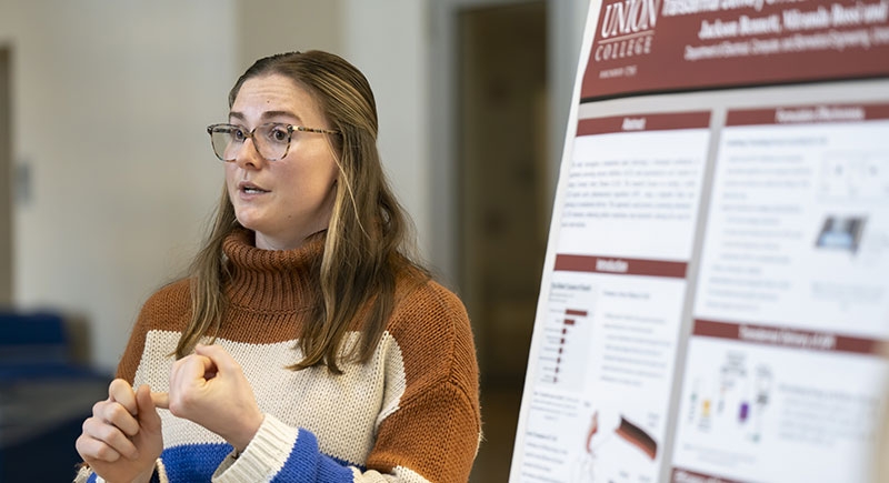 A student presents his research in the Steinmetz Symposium poster session