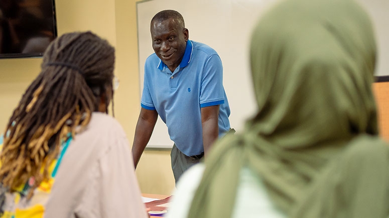 Professor Cheikh Ndiaye in a classroom with students