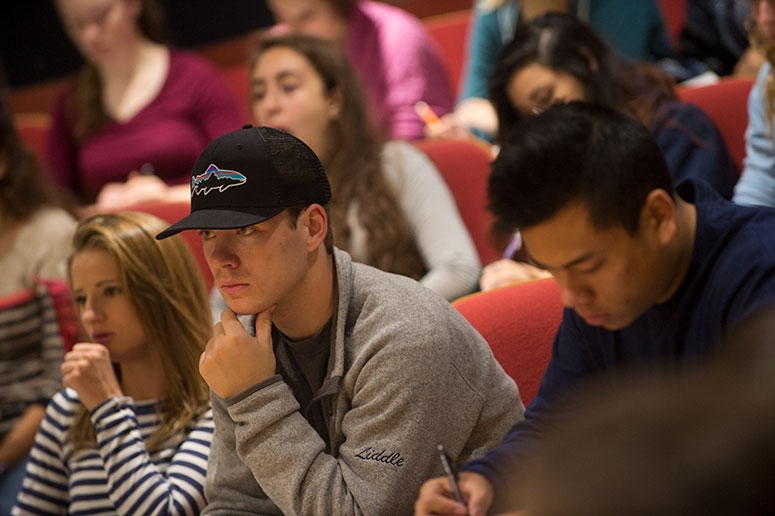 Students in a classroom listening intently