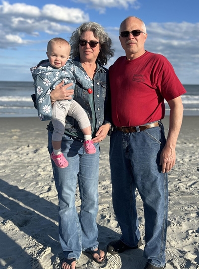 Jennifer Blessing and her husband, Wes, with their grandchild, Addison, at Myrtle Beach last spring.