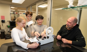 On a recent weekday afternoon, Olivia Belfonti ’27, Michael Fitzmaurice ’27 and Adam Otsuka ’27, examine a pultrusion machine in Union’s 3D lab on the ground floor of the Wold Center.