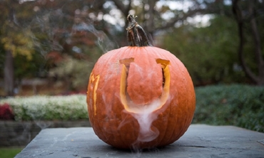 A pumpkin with U carved into it.