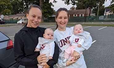 Women's head field hockey coach Kelly Harchetts with Allison (Troy) Lebowitz ‘15, and Lebowitz's twin daughters,