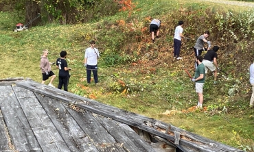 Students work on restoring the Erie Canal Lock 23 historic site in Rotterdam, N.Y.  in fall 2023.